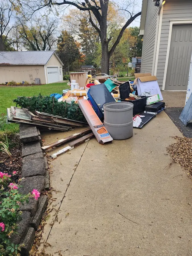 Dumpster being loaded with debris for Commercial Dumpster Rental in Wesleyville